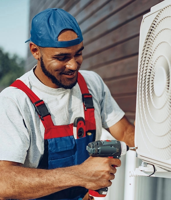 Man Fixing Aircon-ITB Heating & AC